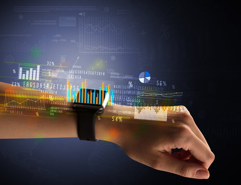 Cloe up naked female hand with smartwatch with financial symbols around