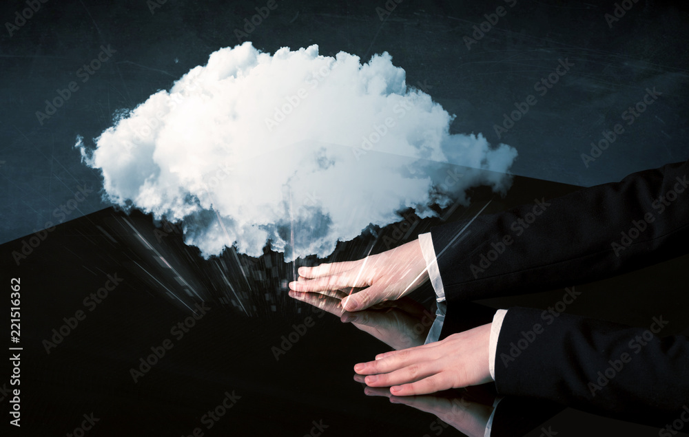 Poster male hands touching interactive table with a white cloud on it