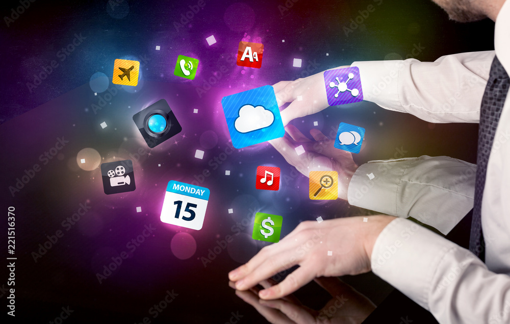 Poster Male hands touching interactive table with colorful application icons on it 