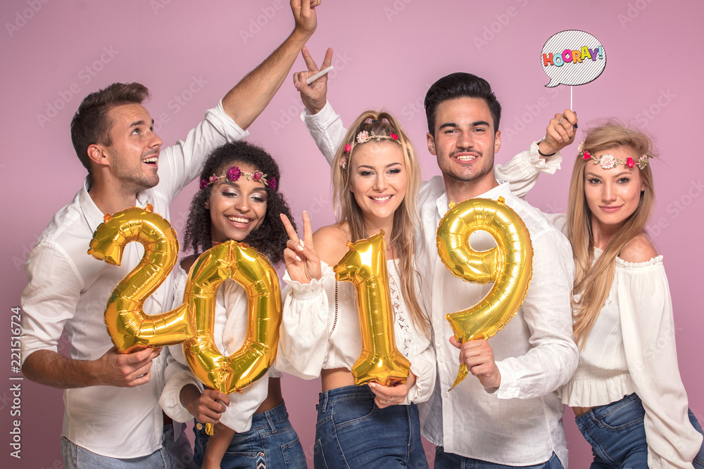 Wall mural Group of people celebrating new year.