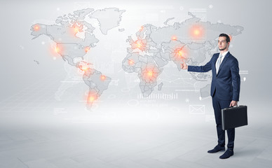 Businessman in dark suit hitchhike to business trip in a front of a map with destination