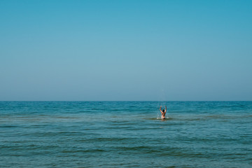 Young girl splashing in the water.