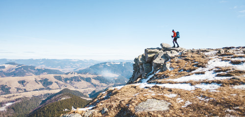 The climber on the top of the mountain.