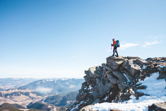 The climber on the top of the mountain.