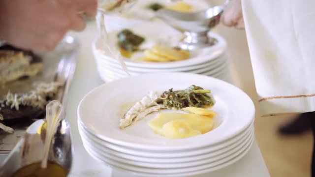 Catering food - catering company preparing large numbers of food for guests of a restaurant or hotel on event party. 4K (UHD).