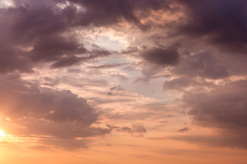 Naklejka na ściany i meble The sky during the sunset in hot orange-purple tones_