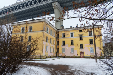 Fototapeta na wymiar Western High-Speed Diameter over the houses on Kanonersky Island in winter. Saint Petersburg. Russia,