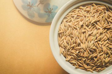 Background and wallpaper by pile of paddy rice and rice seed.