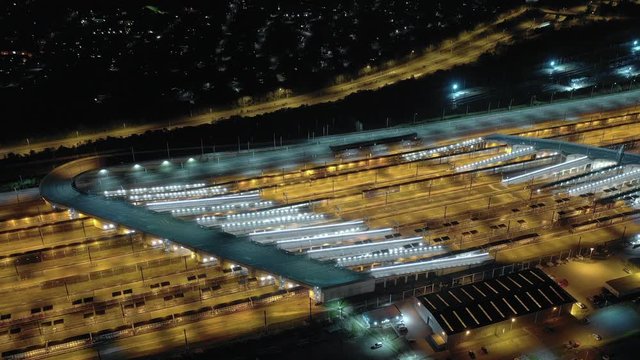 Timelapse of Vehicles Arriving and Departing a Motorail Terminal at Night