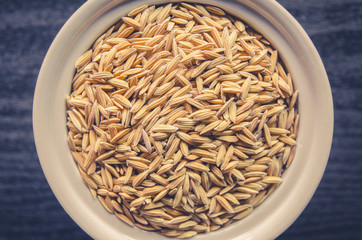 Background and wallpaper by pile of paddy rice and rice seed.