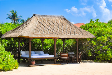 Thatched gazebo is on the beach of Nusa Duo on the island of Bali.Indonesia 