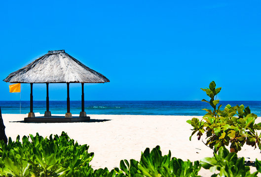 Thatched gazebo on the beach of Nusa Duo.The Island Of Bali.