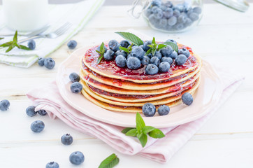 Vintage pancakes outside garden with blueberries