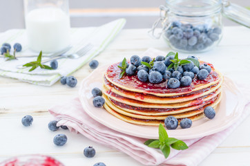 Vintage pancakes outside garden with blueberries
