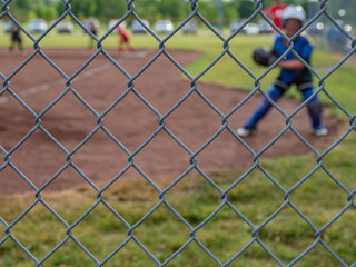 Athletic Softball Behind Chain Link Fence