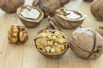 Healthy food safety concept:Walnuts kernels on dark desk with color background