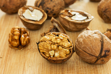 Healthy food safety concept:Walnuts kernels on dark desk with color background