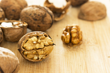 Healthy food safety concept:Walnuts kernels on dark desk with color background