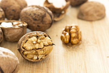 Healthy food safety concept:Walnuts kernels on dark desk with color background