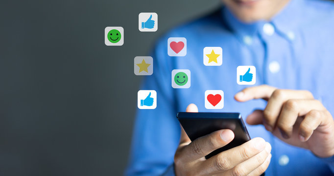 Businessman use smartphones to rate their satisfaction. Customer service experience and satisfaction survey concept
