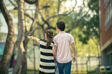 Valentine couples walk hand in hand and walk along the walkway 