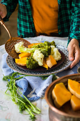 Steamed, cooked, boiled vegetables. Vegan, vegetarian healthy food concept