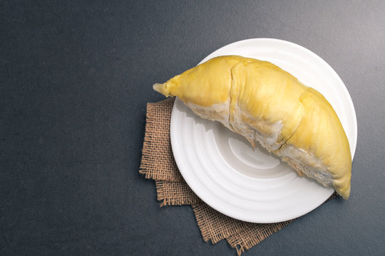 Durian is the king of fruit in white dish on black background