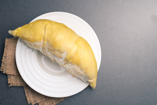 Durian is the king of fruit in white dish on black background