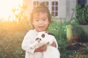 baby girl with rabbit