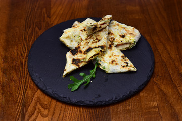 Flatbread bread served on slate. Pita or lavash bread wraps on wooden background. A tasty sandwich is what you deserve