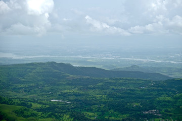 Beautiful landscape aerial, and closeup Photos of nature, roads, grass, trees, village, and farm land. Lush green monsoon nature mountains, hills, Purandar fort, Pune, Maharashtra, India