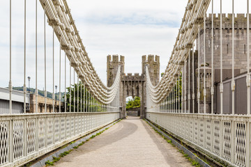 Fototapeta premium Conwy Castle and Conwy Suspension Bridge, UNESCO World Heritage site located in medieval town of Conwy in North Wales UK