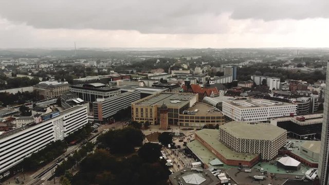 The camera rises into the sky of Chemnitz in Eastern Germany. The central town and the shopping area can be seen.