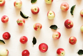 Red apples pattern on white vintage background.Top view.Copy space. flat lay