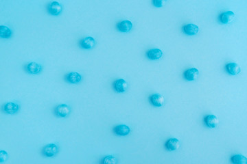 Round blue mint candy caramel on blue background