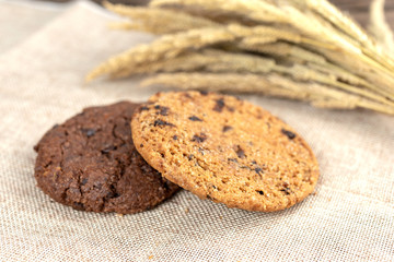 Chocolate cookies on wooden table.