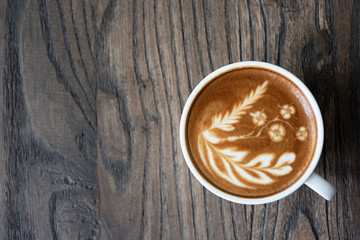 Top view latte art coffee cup.