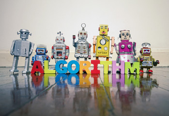 ALGORITHM wooden letters and retro robot toys