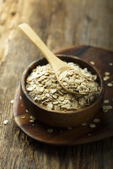 Organic oats in the wooden bowl