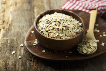 Organic oats in the wooden bowl