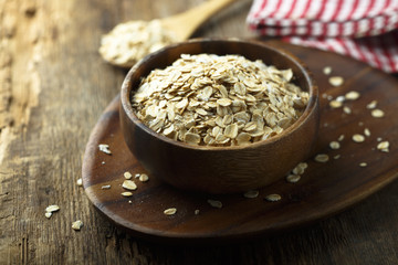 Organic oats in the wooden bowl