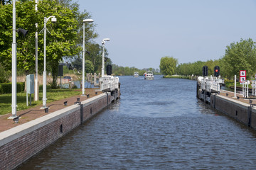 Fototapeta premium boats will enter a modern fully automated lock on a summer day in the Netherlands