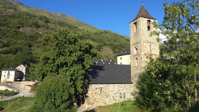Belfry and church of Sant Joan de Boi in Catalonia, Spain. Catalan Romanesque Churches of the Vall de Boi are declared a UNESCO World Heritage Site Ref 988.Pan Camera Movement