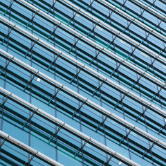 modern office glass facade with a rhythmic pattern of lines