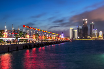 Fototapeta premium Night view of modern urban architecture landscape in Qingdao..