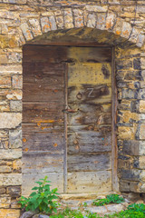Fototapeta na wymiar Door in an old stone facade