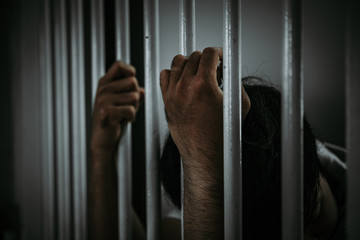 Hands of men desperate to catch the iron prison,prisoner concept,thailand people,Hope to be free.