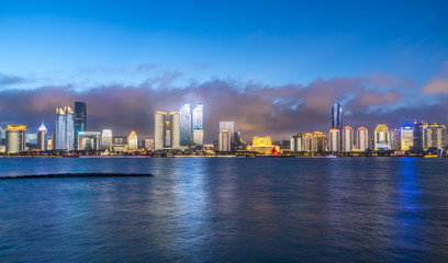 Fototapeta na wymiar Night view of modern urban architecture landscape in Qingdao..