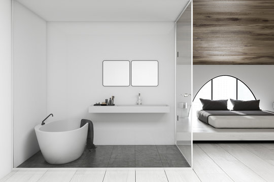 White bathroom and wooden bedroom interior
