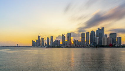 Fototapeta premium Night view of modern urban architecture landscape in Qingdao..